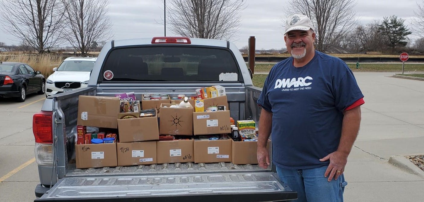 Drives food in pickup with carl