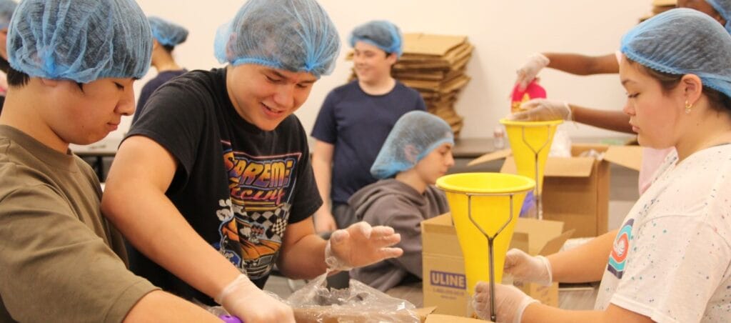 Volunteer kid scooping