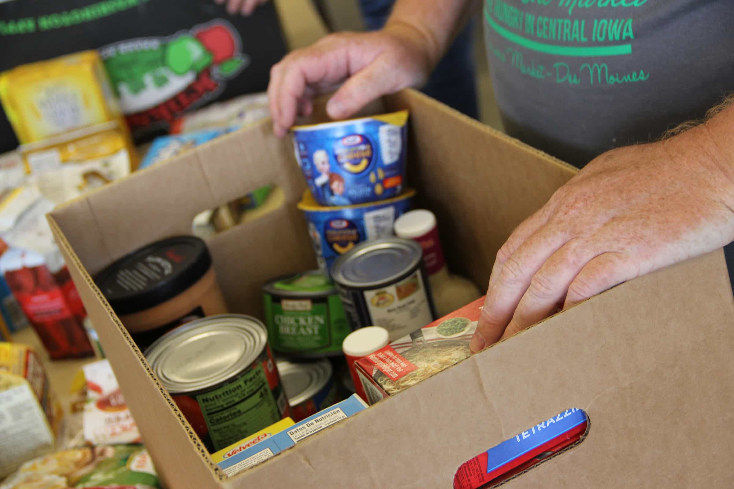 Volunteers sorting food boxes