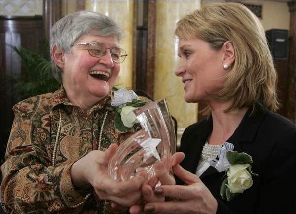 sister Sandy accepts award at Des Moines Register awards. 